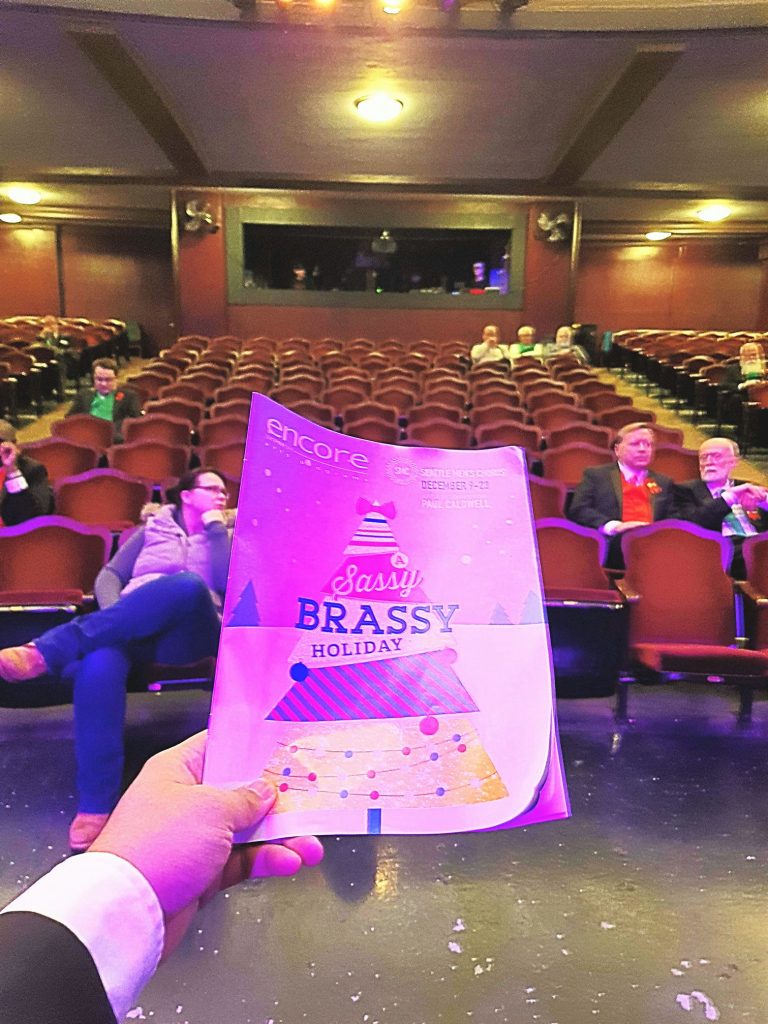 Before the sold out Everett show of the Seattle Men's Chorus waiting for the house to open. — attending A Sassy Brassy Holiday - Everett at Historic Everett Theatre Preservation Society.